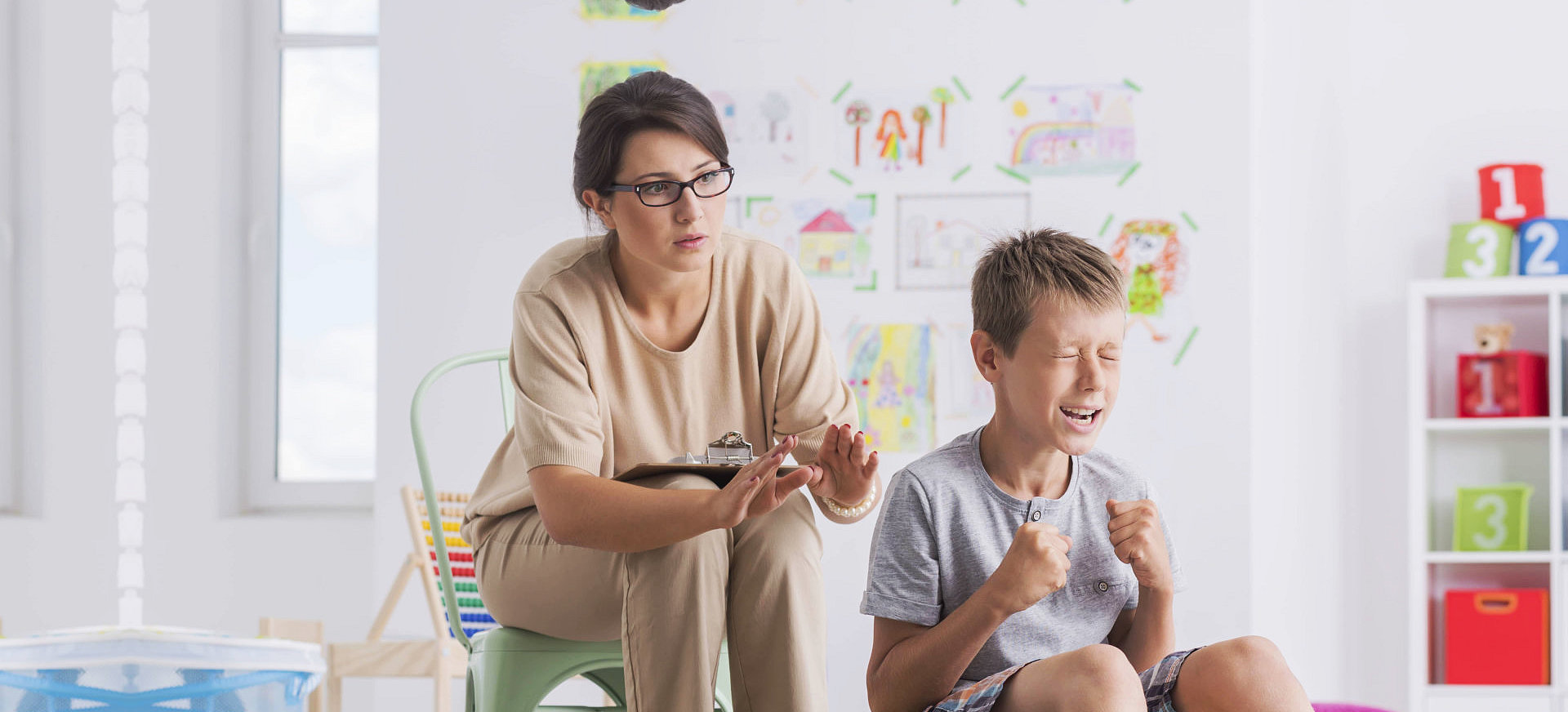 young boy undergo psychological examination regarding to emotion