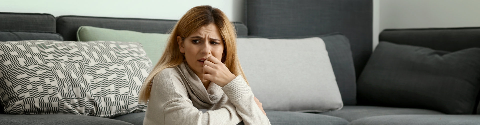 a woman having a panic attack at home
